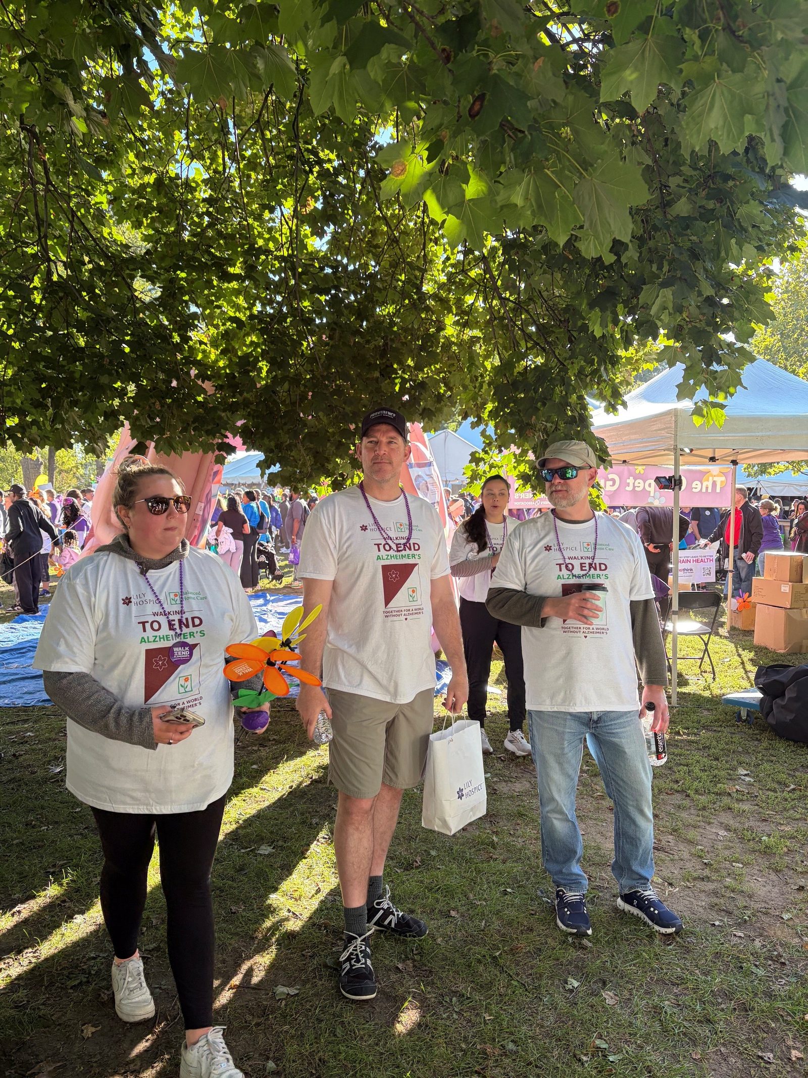Lily Hospice and Balanced Home Care team members in matching Walking to End Alzheimer's shirts at the 2026 Detroit Walk